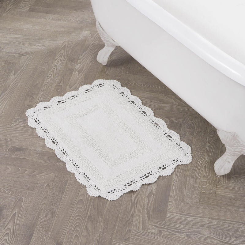 Laura Ashley Absorbent Bath Mat Reversible Crochet Soft and Plush Bathroom Mat 100% Cotton 17x24 Bath Rug, White - Image 1